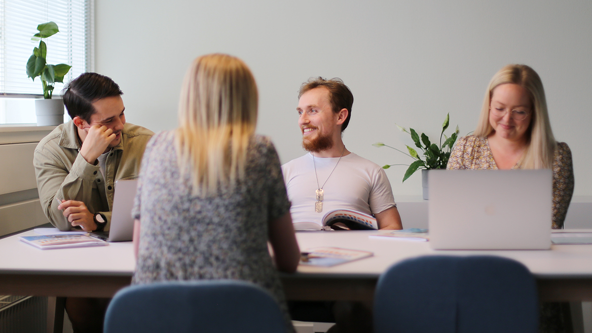 Four colleagues around a table